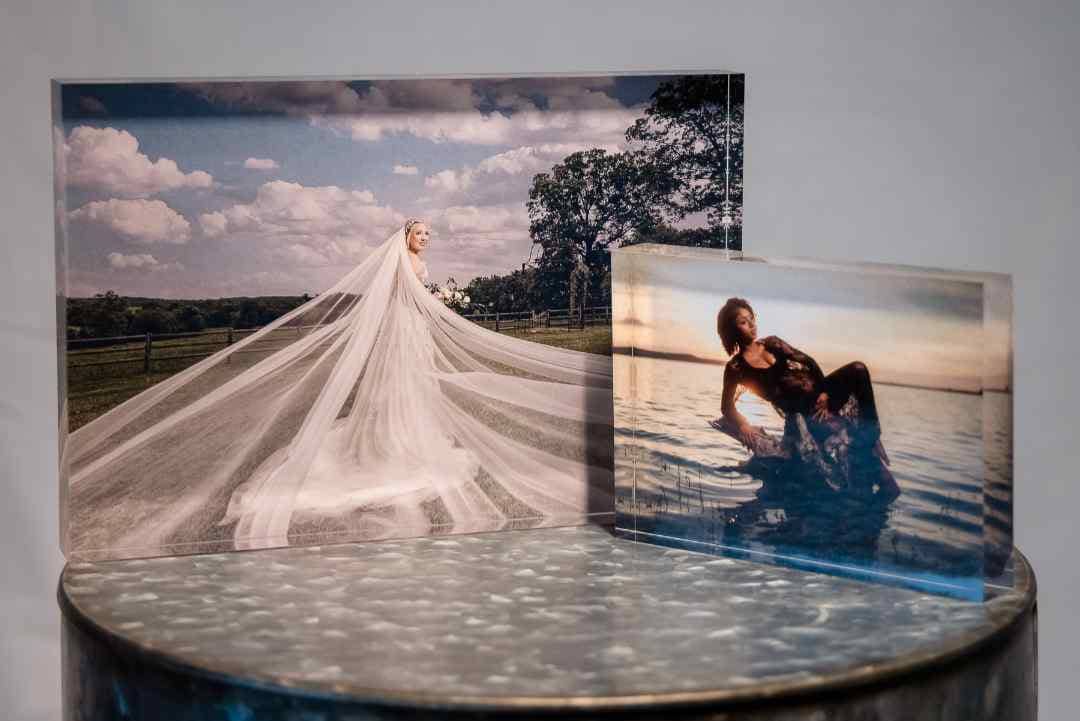 2 acrylic photo blocks displaying a bridal photo and a maternity photo
