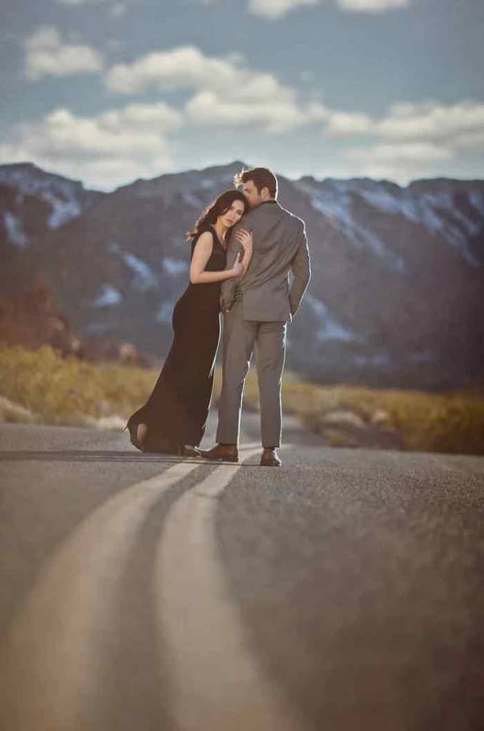 Romantic engagement picture with mountains in the background